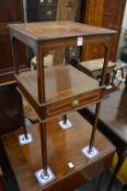 An Edwardian inlaid mahogany two-tier single drawer bedside table.