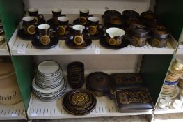 A large quantity of Denby Arabesque dinner ware and other Denby plates.