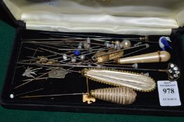 A collection of hat pins.