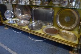A collection of silver plated trays and salvers.