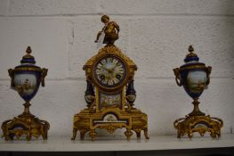 A good French ormolu and porcelain three piece clock garniture.