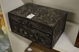 A carved wood box.