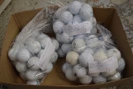 A large quantity of golf balls.