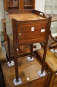 A small 19th century mahogany tray top pot cupboard.