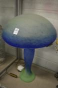 An Art Nouveau style blue and green glass mushroom shaped table lamp.