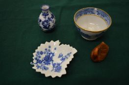 A blue and white tea bowl and other items.