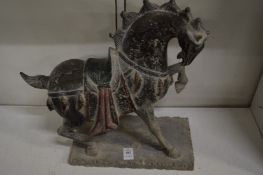 A carved stone Tang style horse.