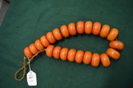 A large amber bead necklace.