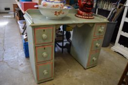 A decoratively painted pine kneehole dressing table or desk.
