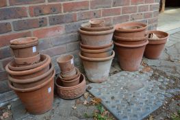 A quantity of terracotta plant pots.