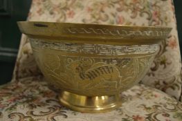 A Chinese brass pedestal bowl.