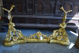 A good pair of French ormolu chenets with fender.