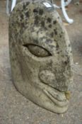 Composite stone stylised head.