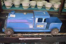 Triang tin plate model of a train, a painted wooden model of a train and a traction engine.