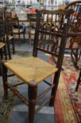 A set of four Lancashire spindle back dining chairs.