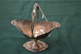 Asprey of London, a small silver swing handled basket.