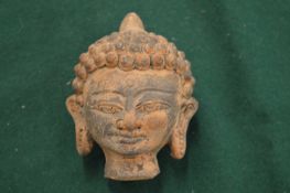 A terracotta Thai Buddha's head.