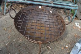 A wrought iron fire pit.