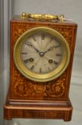 A good Victorian marquetry inlaid rosewood mantel clock striking on the hour and half hour.