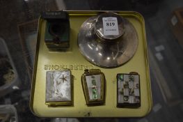 Three mother of pearl inlaid cigarette lighter style perfume atomisers together with a silver