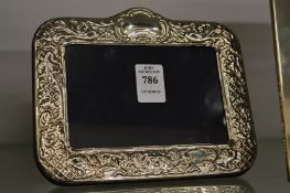 An embossed silver photograph frame.