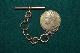 An 1823 double sovereign, worn, mounted on a 9ct gold fob chain.