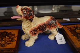 A cast iron dog with articulated tongue.