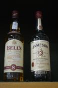 Bells whiskey, one bottle and Jameson whiskey, one bottle.