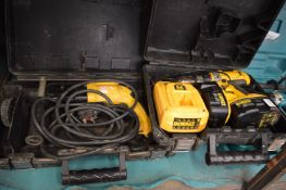 A De Walt 18 volt drill driver with two batteries and charger, cased together with a De Walt