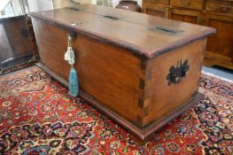 A good large heavy Eastern coffer with metal hinges and carrying handles.