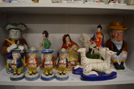 A good collection of Staffordshire items to include toby jug, set of four figural cruets and other