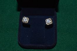 A pair of gilded silver and 2ct Moissanite studs with certificate, stones etched with certificate