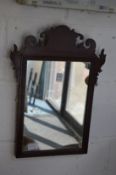 A small mahogany fretwork framed mirror.