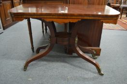 A 19th century mahogany D shaped fold-over tea table on curving legs (faults).