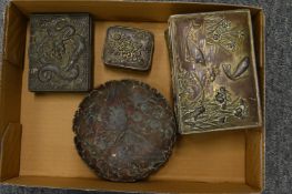 A Chinese embossed metal cigarette box and three similar items.