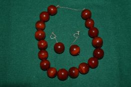 A chunky bead necklace and earrings.