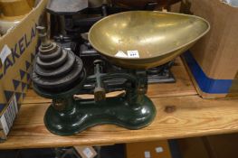Two good sets of kitchen scales and weights.