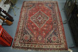 Persian style rug, red ground with stylised decoration, 165cm x 118cm.