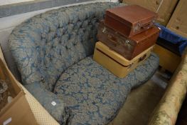 A button back settee.