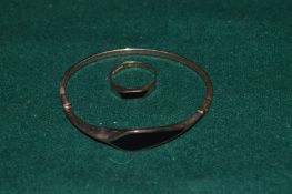 A 9ct gold and enamel bangle together with a similar ring.