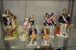 A group of large Staffordshire figures.