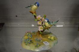 A Crown Staffordshire porcelain group 'Tom Tit' design and modelled by J T Jones (few small losses