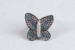 A SILVER DIAMANTE BUTTERFLY RING. Ring size M.