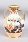 A TWO-HANDLED JAPAN PATTERN VASE. 10ins high.