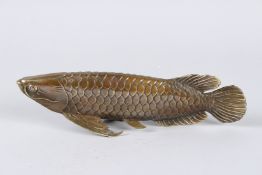 A CHINESE BRONZE CARP. 11ins long.