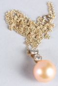 A 9CT YELLOW GOLD NECKLACE comprised of a peach cultured pearl and double bezel-set diamond