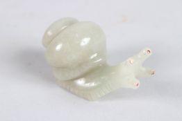 A GOOD JADE SNAIL with sapphire eyes, in a Faberge case. 3.5ins.