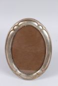 A SILVER OVAL SHAPED PHOTOGRAPH FRAME. 9.5ins x 6.5ins. Birmingham 1945.