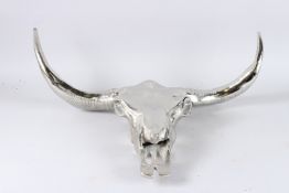 A METAL BULL SKULL WALL DECOR. 2ft 3ins wide.