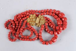 A GOOD 18CT GOLD CLASP CORAL NECKLACE with three strands.